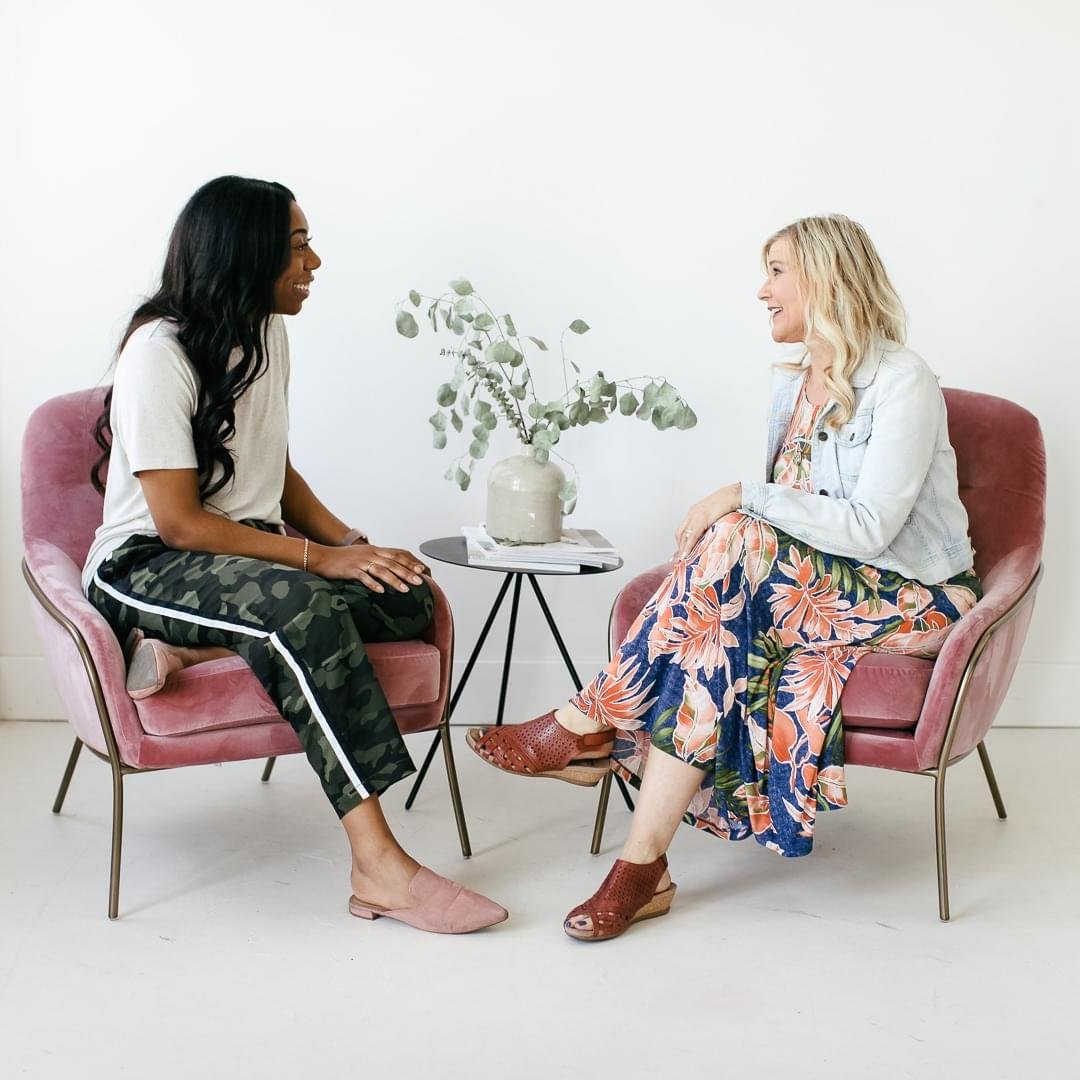 Catherine Speaking to a Woman One on One and Both Smiling